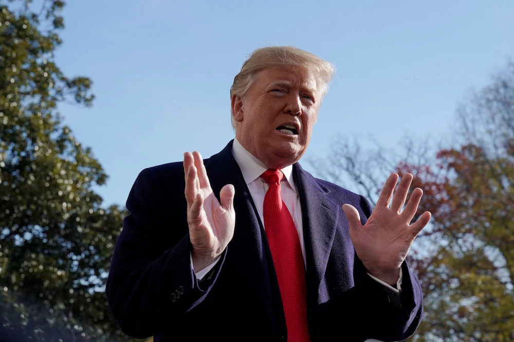 US President Donald Trump talks to reporters as he departs for travel to the G-20 summit in Argentina from the White House in Washington, US, November 29, 2018. (Reuters)