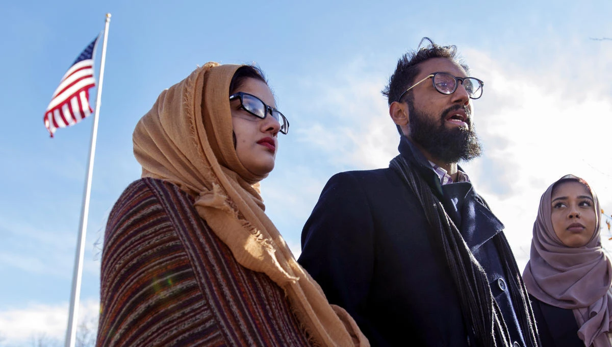In this Nov. 14, 2018, photo, Jamaal Siddiqui, center, uncle of a student at the Hemenway Elementary School in Framingham, Mass., who received threatening notes, talks with reporters in Framingham. (AP)