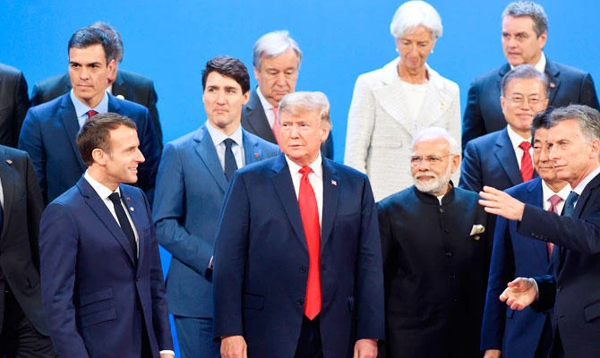 (L-R, bottom) France's President Emmanuel Macron, US President Donald Trump, India's Prime Minister Narendra Modi, Japan's Prime Minister Shinzo Abe, and Argentina's President Mauricio Macri line up for a family photo, during the G20 Leaders' Summit in Buenos Aires, on November 30, 2018. (AFP)