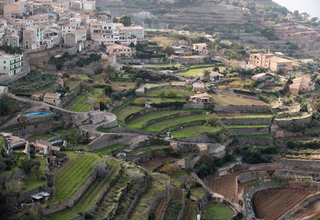 Picture shows terraces built using the dry stone technique in Banyalbufar on the Spanish Balearic Island of Mallorca on December 11, 2018. The art of dry stone walling, inscribed in 2018 on the Representative List of the Intangible Cultural Heritage of Humanity, (sometimes called drystack) is a building method by which structures are constructed from stones without any mortar to bind them together. Dry stone structures are stable because of their unique construction method, which is characterized by the presence of a load-bearing facade of carefully selected interlocking stones. / AFP / JAIME REINA