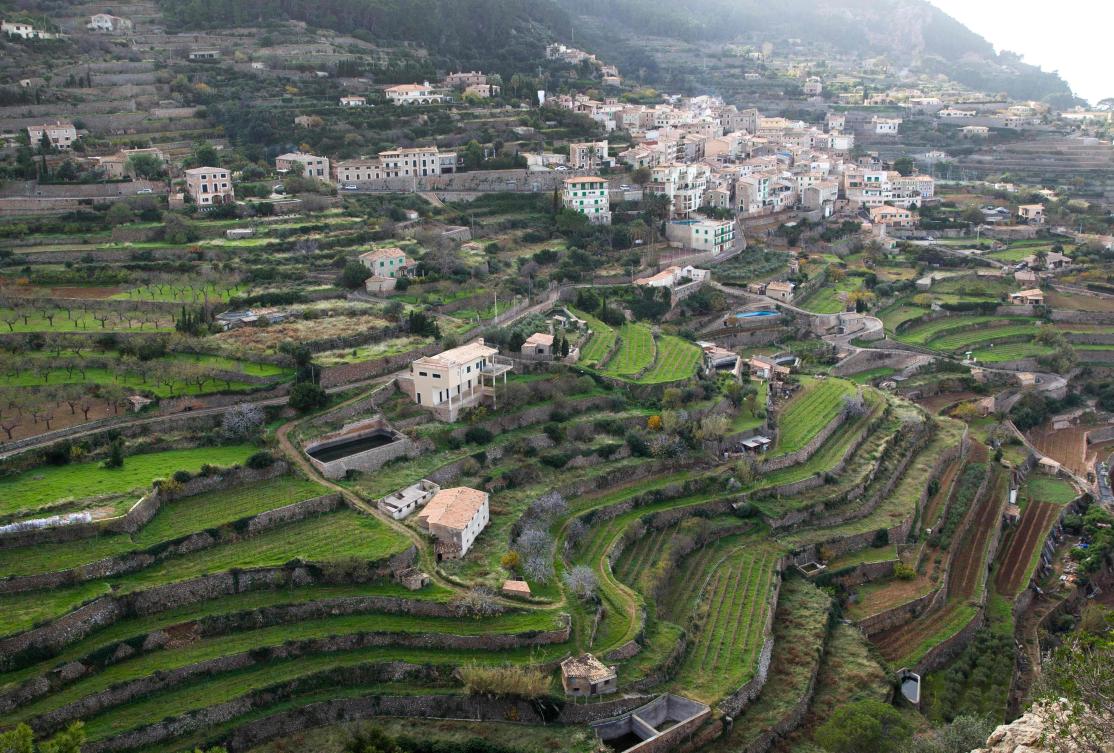 Picture shows terraces built using the dry stone technique in Banyalbufar on the Spanish Balearic Island of Mallorca on December 11, 2018. The art of dry stone walling, inscribed in 2018 on the Representative List of the Intangible Cultural Heritage of Humanity, (sometimes called drystack) is a building method by which structures are constructed from stones without any mortar to bind them together. Dry stone structures are stable because of their unique construction method, which is characterized by the presence of a load-bearing facade of carefully selected interlocking stones. / AFP / JAIME REINA