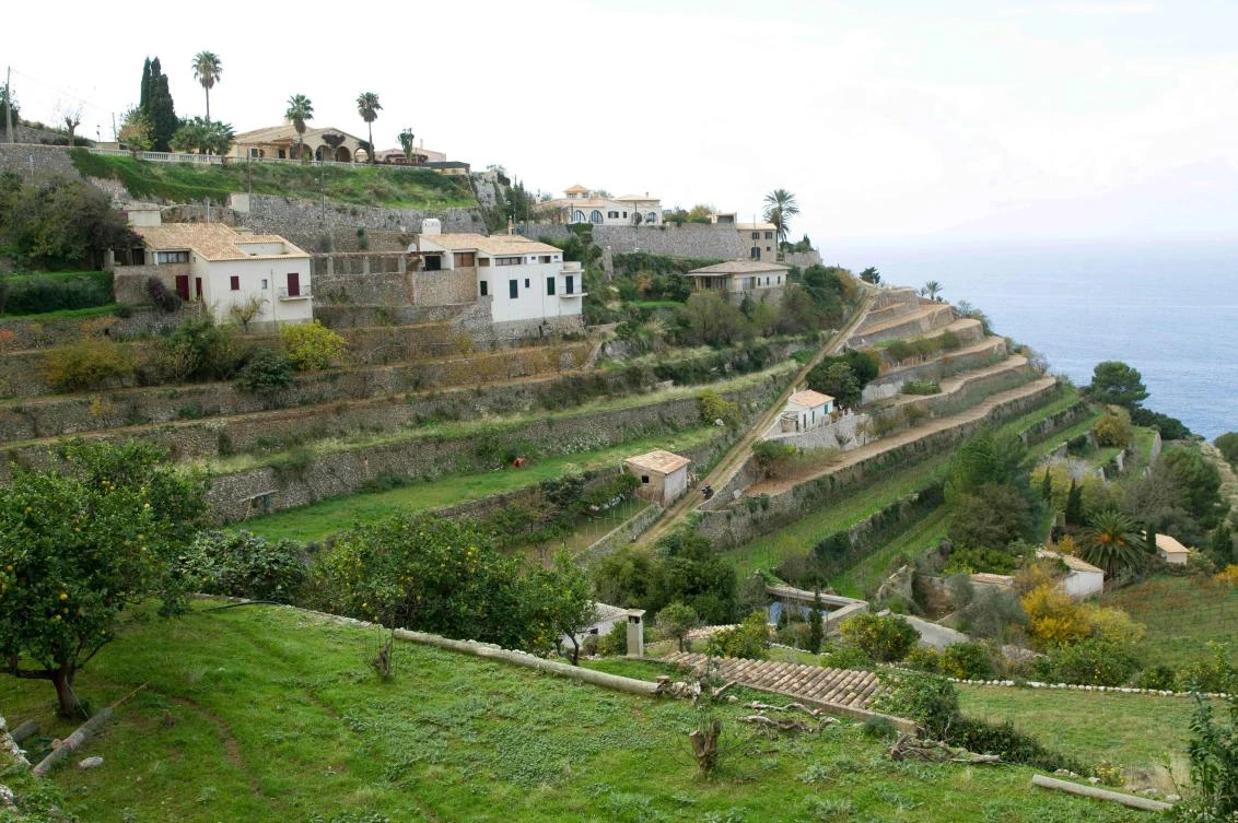 Picture shows terraces built using the dry stone technique in Banyalbufar on the Spanish Balearic Island of Mallorca on December 11, 2018. The art of dry stone walling, inscribed in 2018 on the Representative List of the Intangible Cultural Heritage of Humanity, (sometimes called drystack) is a building method by which structures are constructed from stones without any mortar to bind them together. Dry stone structures are stable because of their unique construction method, which is characterized by the presence of a load-bearing facade of carefully selected interlocking stones. / AFP / JAIME REINA