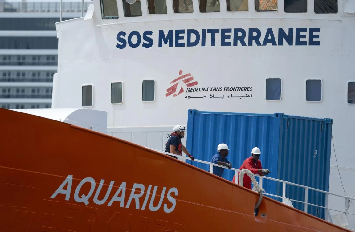 In this file photo taken on August 15, 2018 crew members stand aboard the Aquarius rescue ship as it arrive at Bolier Wharf in Senglea, Malta. (AFP)