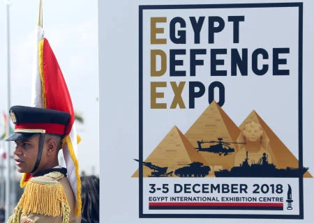 An Egyptian honor guard soldier stands in front of a poster advertising the first arms fair organized in Cairo, Egypt, Monday, Dec. 3, 2018. Egypt's President Abdel Fattah al-Sisi inaugurated the fair, where hundreds of companies are participating. (AP)