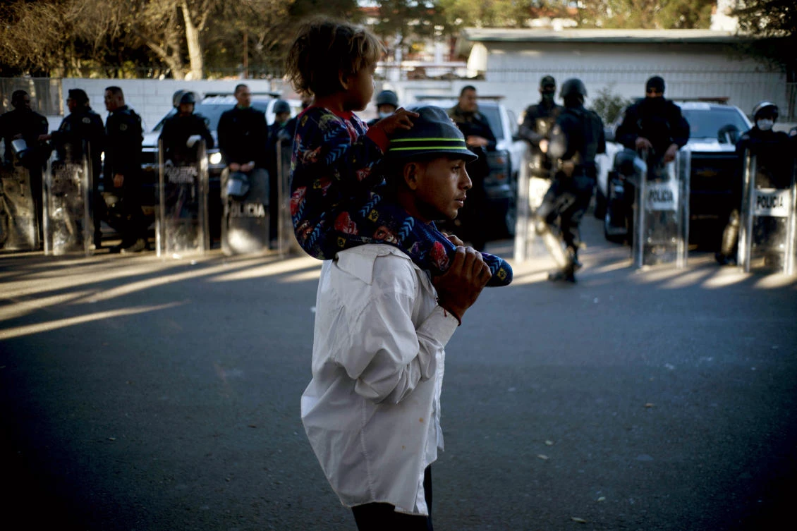 Tired of waiting for asylum, migrants from caravan breach US border
