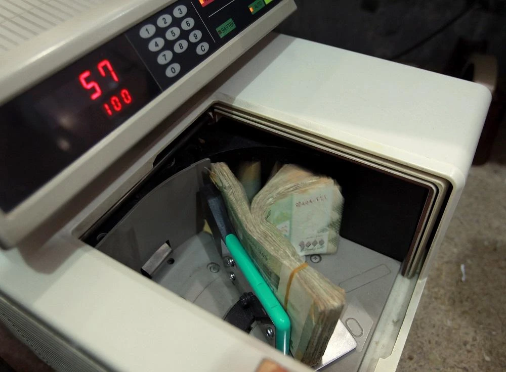 Local currency is counted at a Yemeni money exchange office in Sanaa on December 9, 2014.(File/AFP)