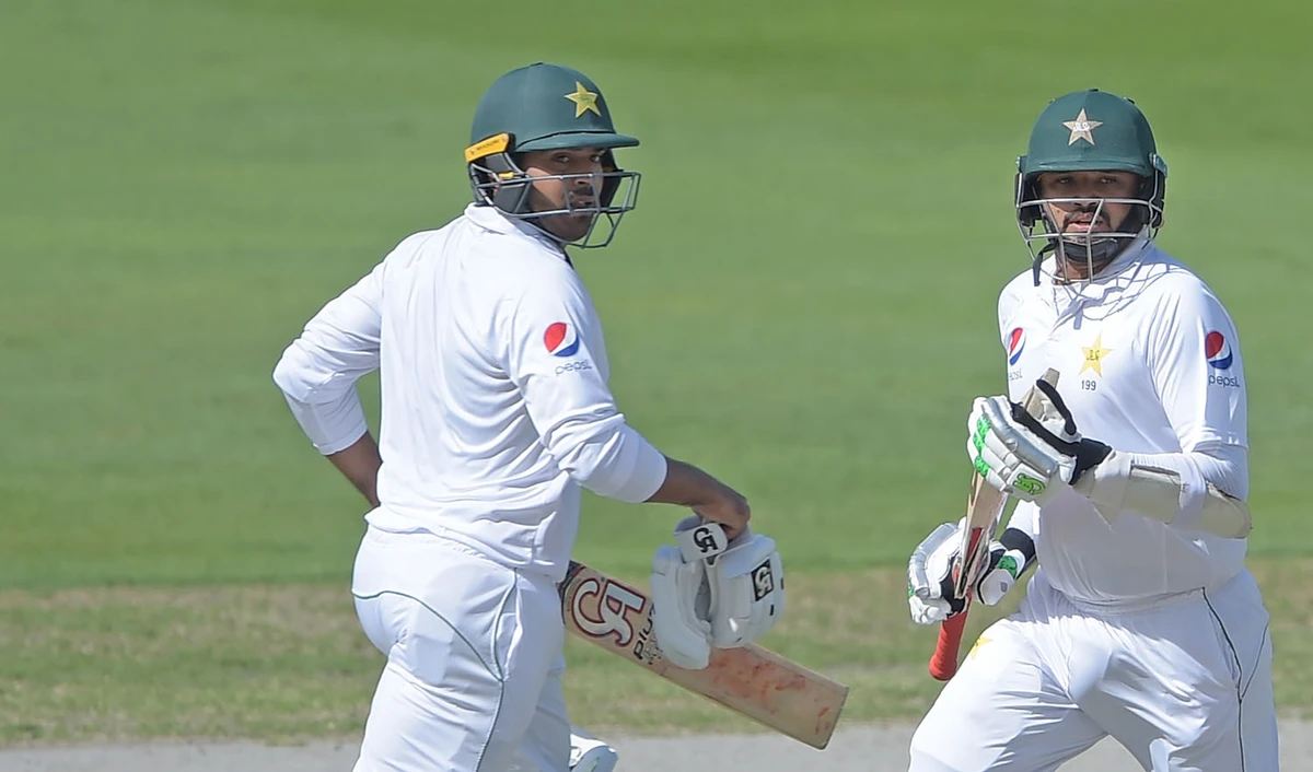 Pakistani batsmen Azhar Ali, right, and Haris Sohail run between the wickets during the first day of the second Test cricket match between Pakistan and New Zealand in Dubai on Nov. 24, 2018. (AFP)