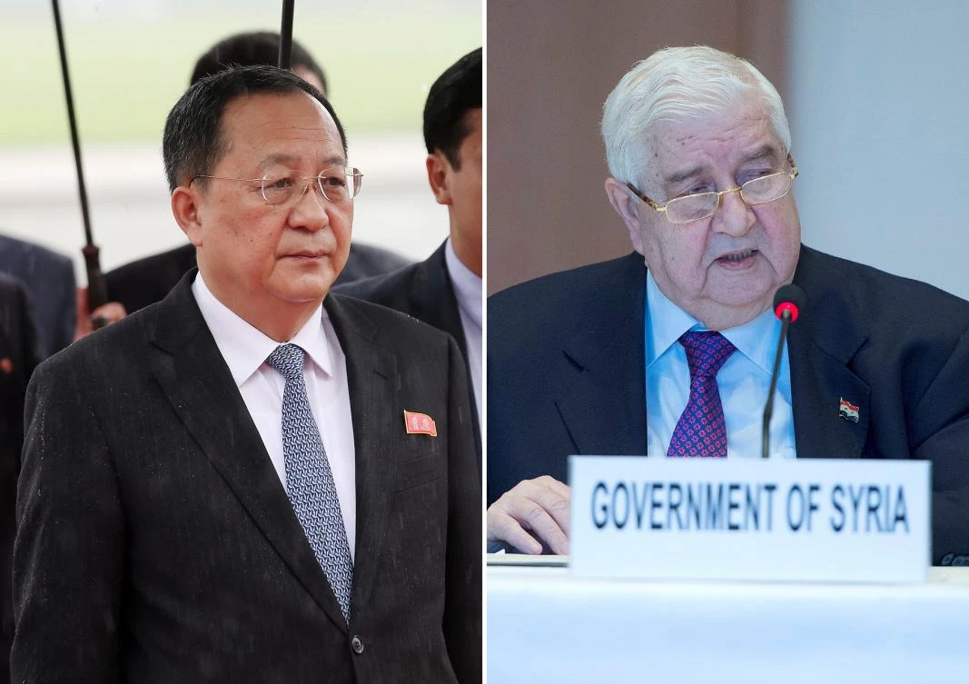 North Korea’s Ri Yong Ho (L) thanked Walid Al-Moualem (R) for Syria’s opposition to economic sanctions on Pyongyang. (File/AFP)