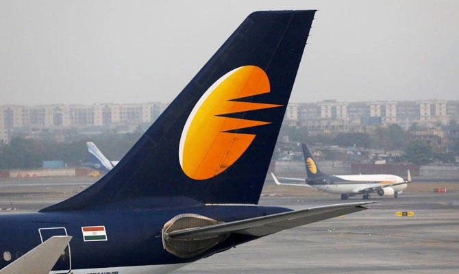A Jet Airways plane is parked as another moves to the runway at the Chhatrapati Shivaji International airport in Mumbai, India, February 14, 2018. (REUTERS)