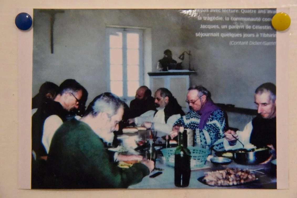 A picture taken on November 28, 2018, shows a picture of the seven French Trappist monks glued on a door at the Tibhirine monastery. (AFP)
