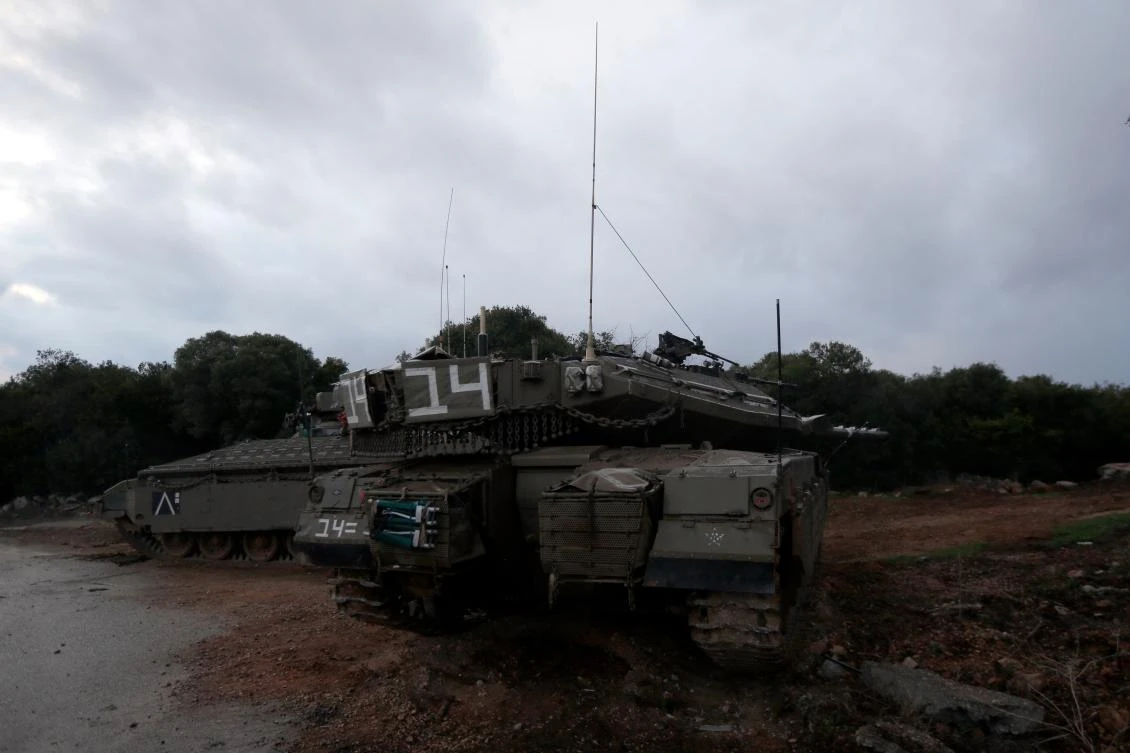 A picture taken on December 5, 2018, near the Israeli town of Zarit, shows Israeli Merkava tanks parked near the border with Lebanon, after the area was declared a closed military zone by the Israeli army. Israel's army said earlier in the week that it has discovered Hezbollah tunnels infiltrating its territory from Lebanon and launched an operation to destroy them, a move likely to raise tensions with the Iran-backed group. (AFP)