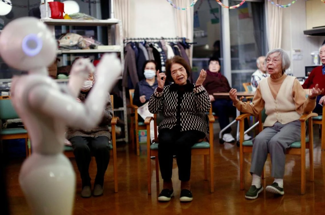Residents follow moves made by humanoid robot ‘Pepper’ during an afternoon exercise routine at Shin-tomi nursing home in Tokyo, Japan. (Reuters)