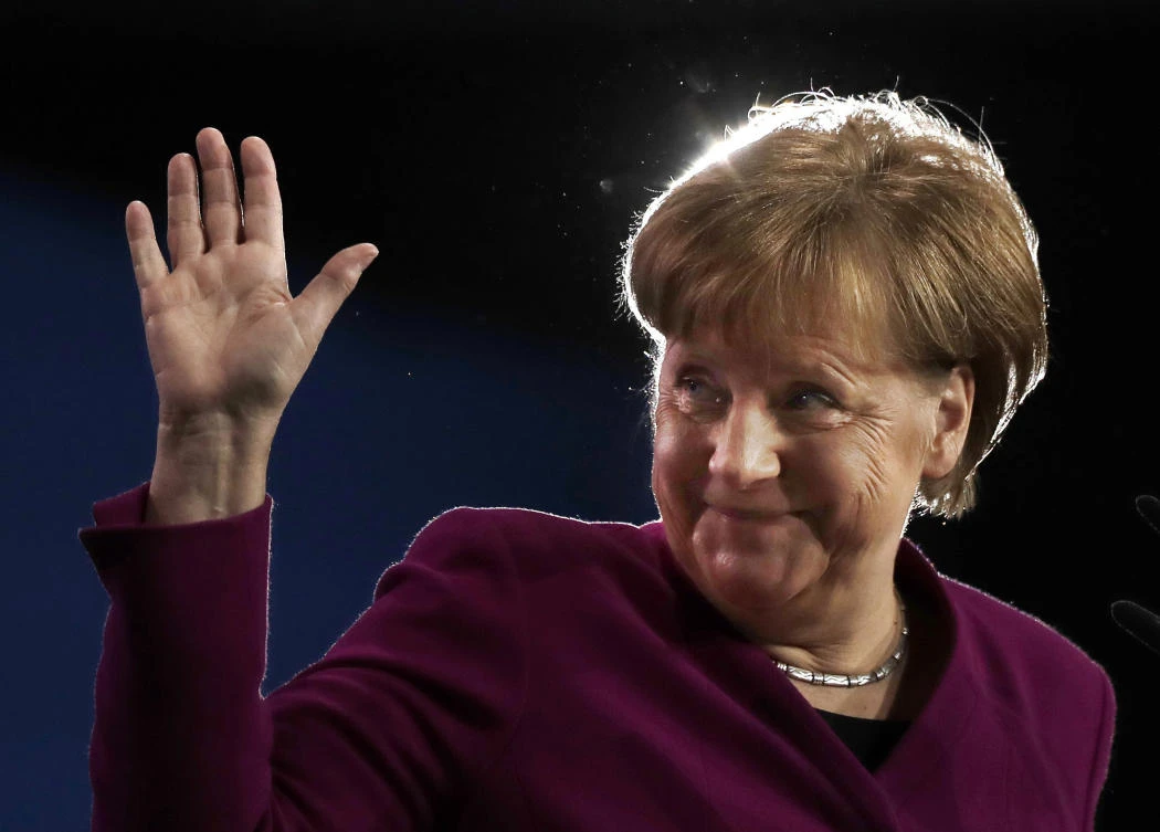 In this Monday, Feb. 26, 2018 file photo German Chancellor and party chairwoman Angela Merkel waves during the party convention of the Christian Democratic Union CDU in Berlin, Germany. (AP)