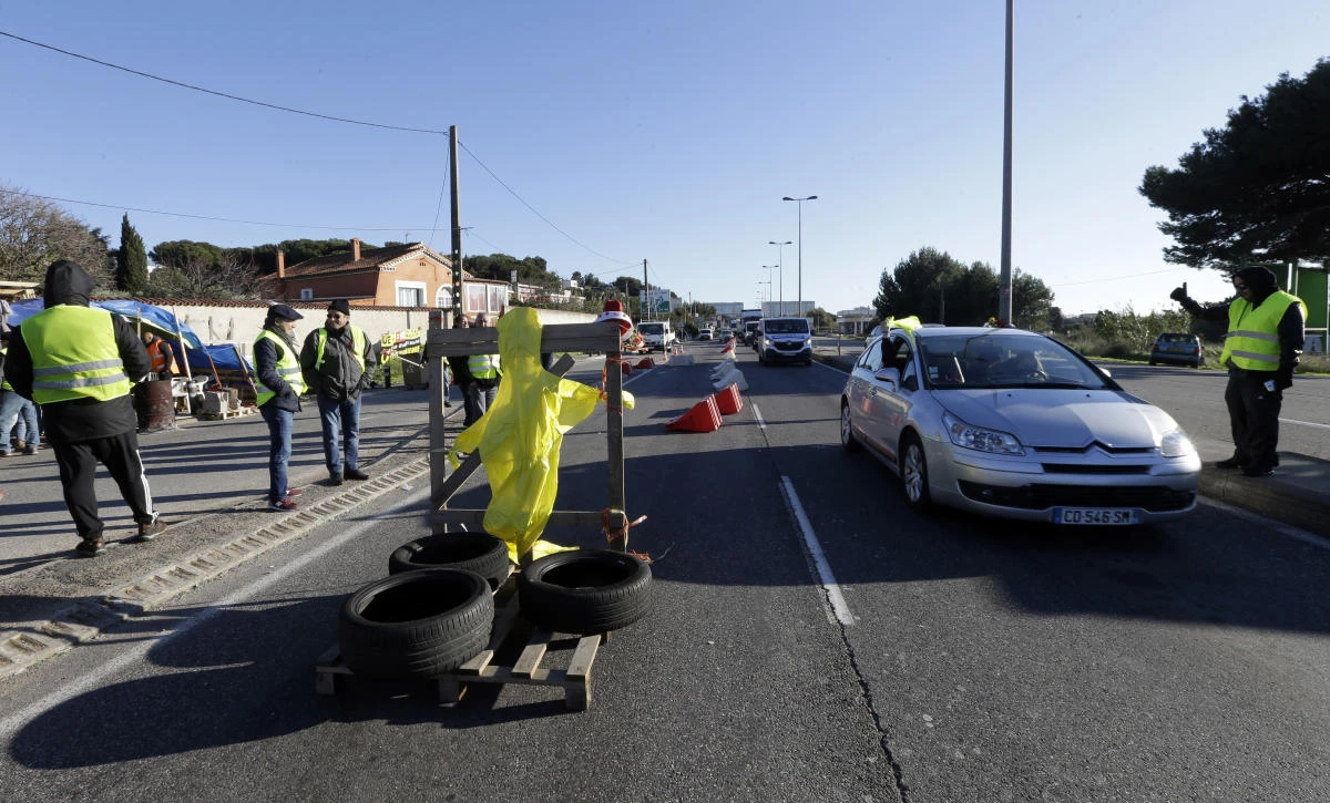 French President Emmanuel Macron says the government will find a way to delay tax increases on fuel during periods when world oil prices are rising. (File/AP)