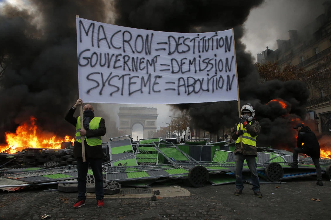 After the worst rioting in Paris in decades last weekend, many shops and restaurants in the center of the capital are expected to shut down Saturday, fearing a repeat of the violence. (File/AP/Michel Euler)