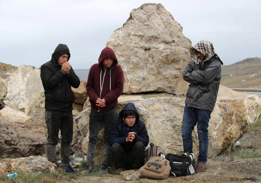 A group of Afghan migrants rest, during a break from their walk, on a main road, after crossing the Turkey-Iran border near Dogubayazit, Agri province, eastern Turkey, in April of this year. (Reuters)