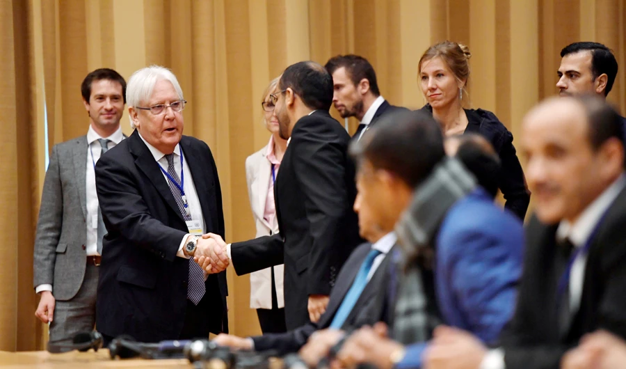 UN envoy to Yemen Martin Griffiths shakes hands with Yemeni delegates peace talks at Johannesburg castle, in Rimbo, Sweden Thursday. (Reuters)