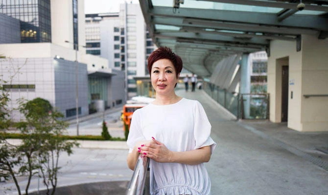 In this photo taken on September 19, 2018, Dora Lai, Cathay Pacific Flight Attendants Union leader and a cabin manager, poses during an interview with AFP in Hong Kong. (AFP)