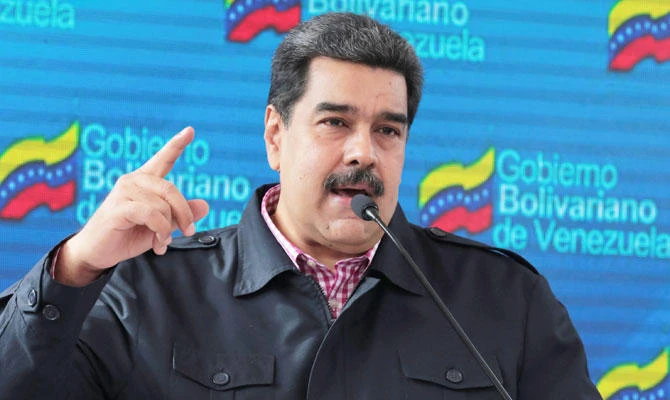 Venezuela's President Nicolas Maduro talks to the media after casting his vote at a polling station during the municipal legislators election in Caracas, Venezuela December 9, 2018. (REUTERS)