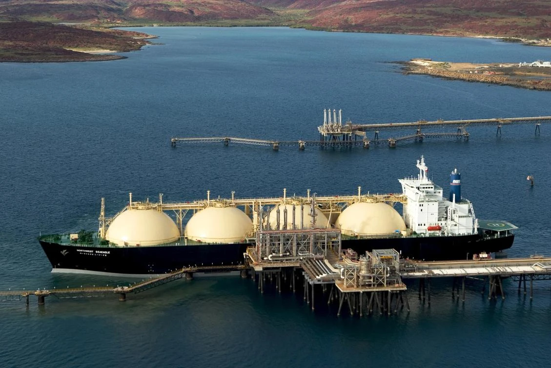 Australia has overtaken Qatar to become the largest exporter of liquefied natural gas (LNG) in the world. Above, a Woodside Energy tanker at the Karratha loading terminal in Western Australia. (AFP)