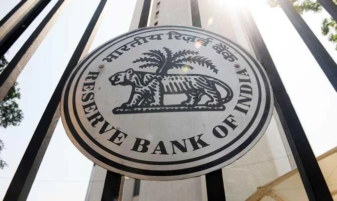 In this file photo taken on April 1, 2014, the Reserve Bank of India (RBI) logo is seen on the main entrance gate of the RBI headquarters in Mumbai. (AFP)