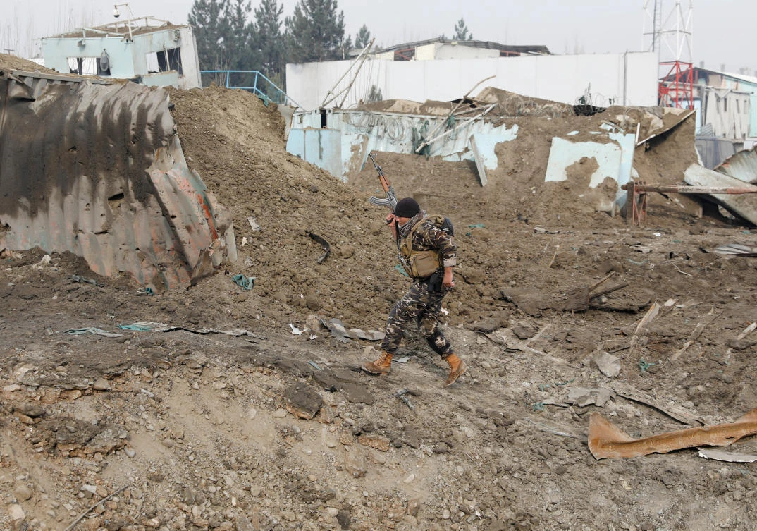 A member of Afghan security force walks at the site of a car bomb attack in Kabul, Afghanistan. (File/Reuters)