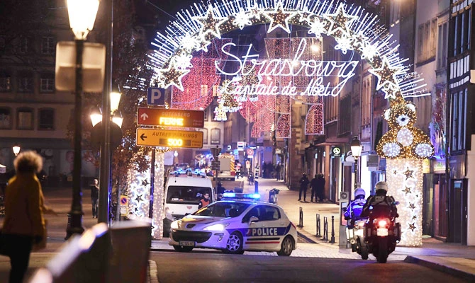 A police car drives in the streets of Strasbourg, eastern France, after a shooting breakout, on December 11, 2018. (AFP)