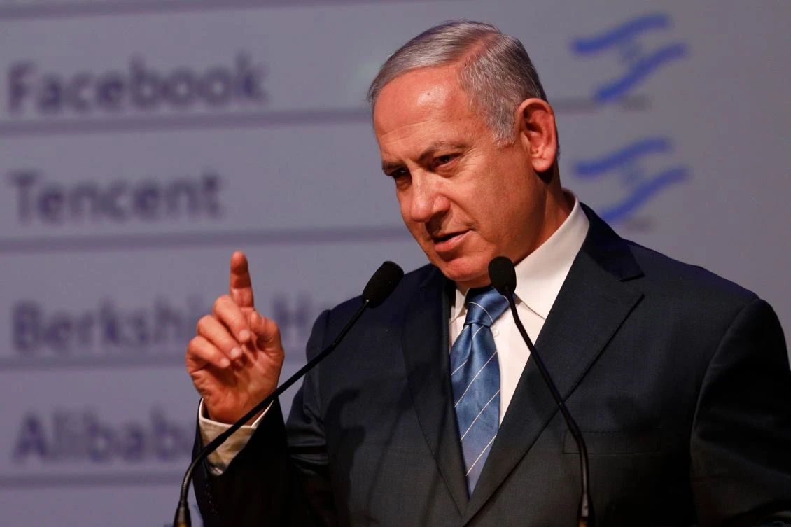 Israeli Prime Minister Benjamin Netanyahu gestures as he speaks during the annual GPO (government press office) New Year's toast in Jerusalem on December 12, 2018. (AFP)