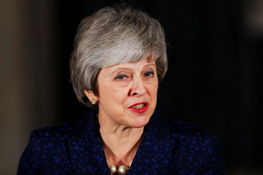 Prime Minister Theresa May on Wednesday survived a bid by her own MPs to unseat her, securing the support of 200 Conservative colleagues while 117 voted against her. (AFP)