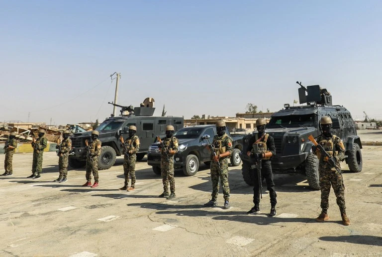 In this file photo taken on September 11, 2018, members of the Syrian Democratic Forces (SDF) gather in the town of Shadadi, about 60 kilometres (37 miles) south of the northeastern Syrian city of Hassakeh, on September 11, 2018. (File/AFP)