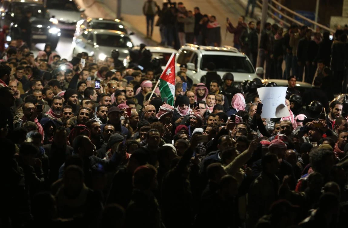 Jordanian protesters march during a demonstration against the government’s decision to raise taxes in the capital Amman, on December 13, 2018. (AFP)
