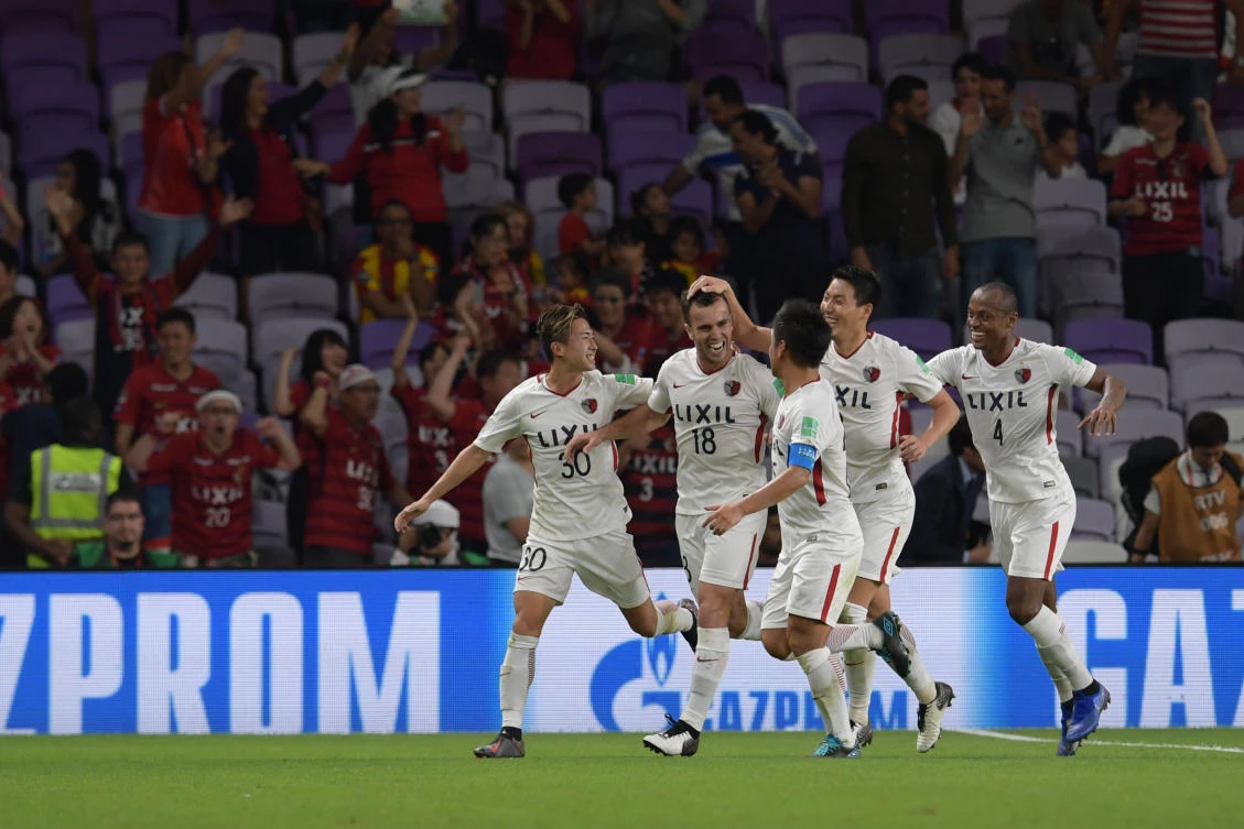 Kashima Antler's midfielder Serginho (2nd-L) celebrates his goal during the second round match of the FIFA Club World Cup 2018 football tournament between Japan's Kashima Antlers and Mexico's C.D. Guadalajara at the Hazza Bin Zayed Stadium in Abu Dhabi, the capital of the United Arab Emirates, on December 15, 2018. / AFP / Giuseppe CACACE