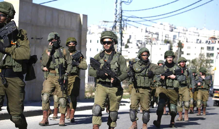 Israeli troops return after blowing up a Palestinian’s house in Ramallah on Saturday. (AFP)