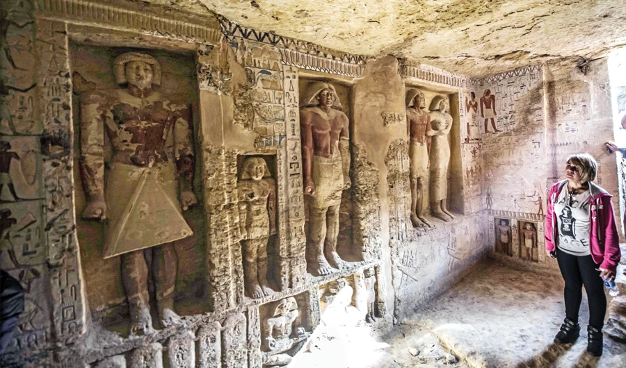 Guests enter a newly discovered tomb, belonging to the high priest ‘Wahtye,’ who served during the 5th dynasty reign of King Neferirkare (2500-2300 BC), at the Saqqara necropolis, 30 km from Cairo, on Saturday. (AFP)