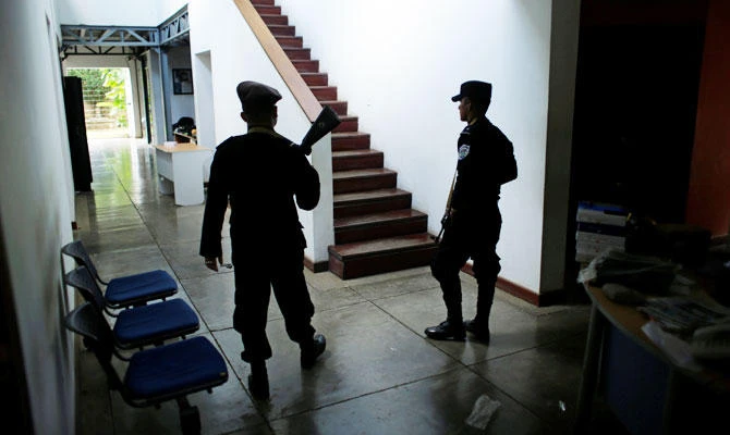 Nicaragua police raid opposition paper, end rights groups’ permits
