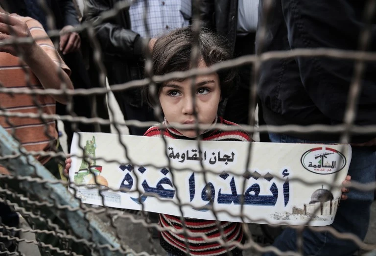 Palestinians take part in a protest against the US move to freeze funding for the UN agency for Palestinian refugees (UNRWA) at the Rafah refugee camp in the southern Gaza Strip on February 6, 2018. (File/AFP)
