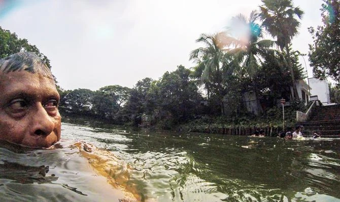 In this photograph taken on October 4, 2018, Bangladeshi swimmer Kshitindra Baisya swims in a lake in Dhaka. (AFP)