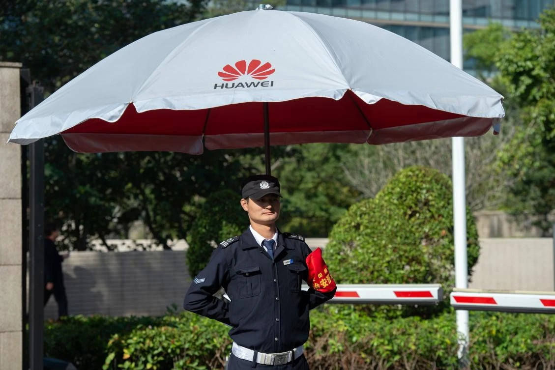 Huawei said it expects revenue to exceed $100 billion this year. Above, a security guard at the entrance to Huawei’s global HQ in Shenzhen, China. (AFP)