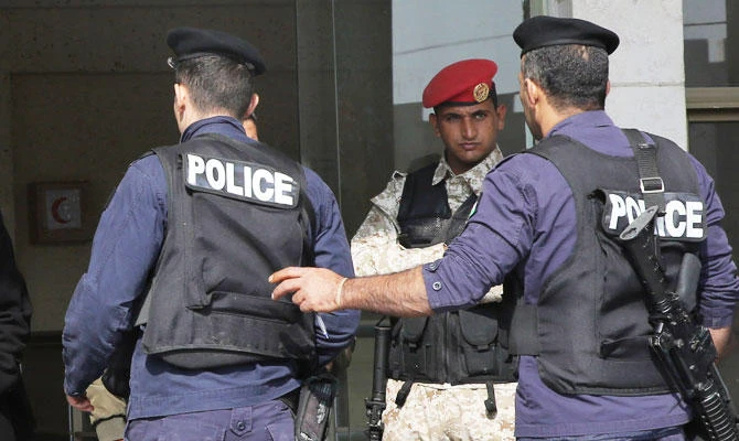 Jordanian security police stand guard outside a court in Amman, in this November 13, 2018 photo. (AFP)
