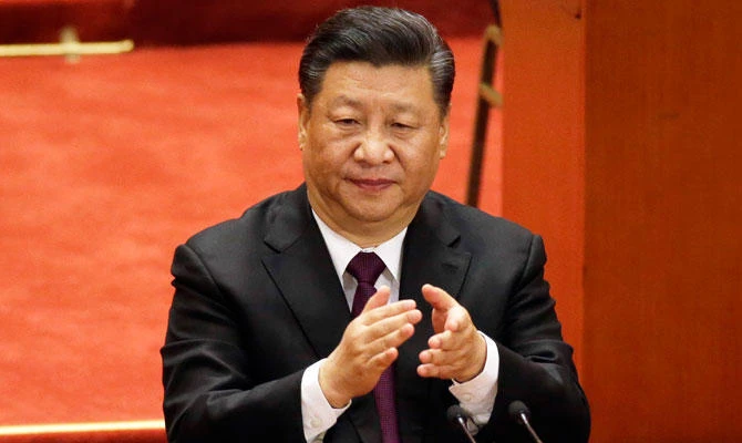 Chinese President Xi Jinping applauds during a conference to commemorate the 40th anniversary of China's Reform and Opening Up policy at the Great Hall of the People in Beijing, Tuesday, Dec. 18, 2018. (AP)