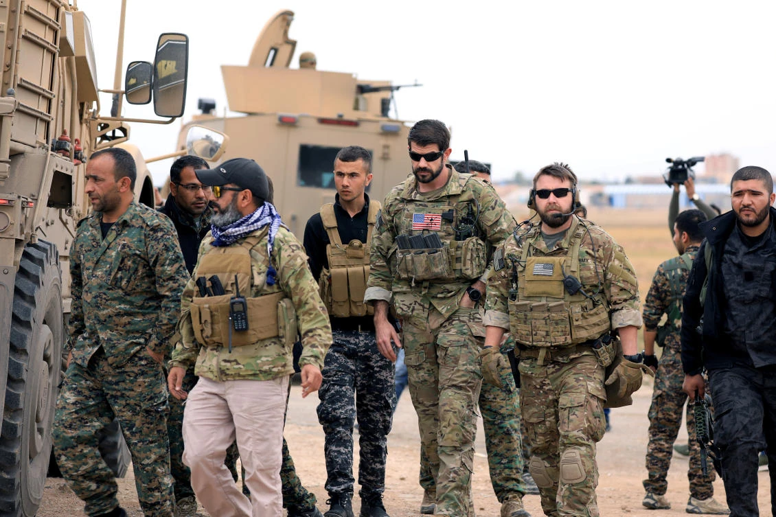 Syrian Democratic Forces and US troops during a patrol near Turkish border in Hasakah last month. (Reuters)