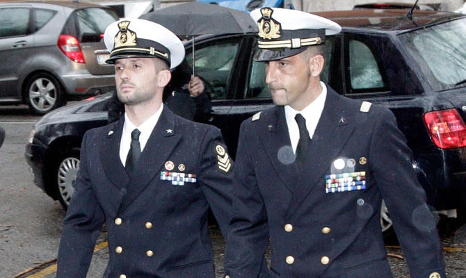 In this March 20, 2013 file photo Italian marines Salvatore Girone, left, and Massimiliano Latorre, arrive at a military prosecutor's office in Rome. (AP)
