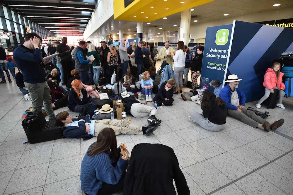 Tens of thousands of stuck passengers wait at the North Terminal at London Gatwick Airport just days before Christmas. (AFP)