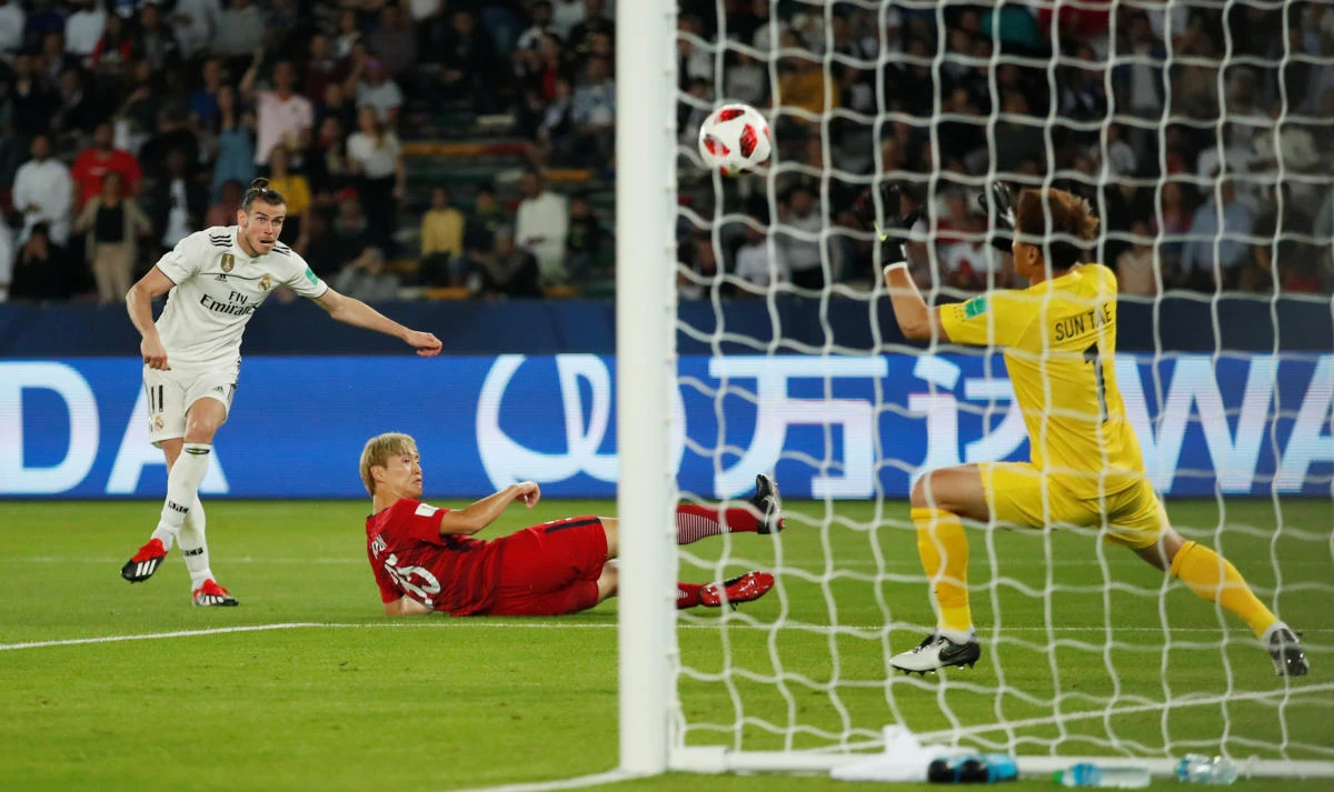 Real Madrid's Gareth Bale scores their third goal to complete his hat-trick against Kashima Antlers. (Reuters)