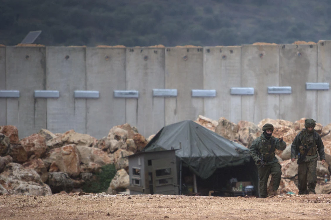 Israeli soldiers, right, serve near the Israel-Lebanon border where the army is digging to look for tunnels from Lebanon in the northern Israeli town of Metula, Wednesday, Dec. 19, 2018. (AP)