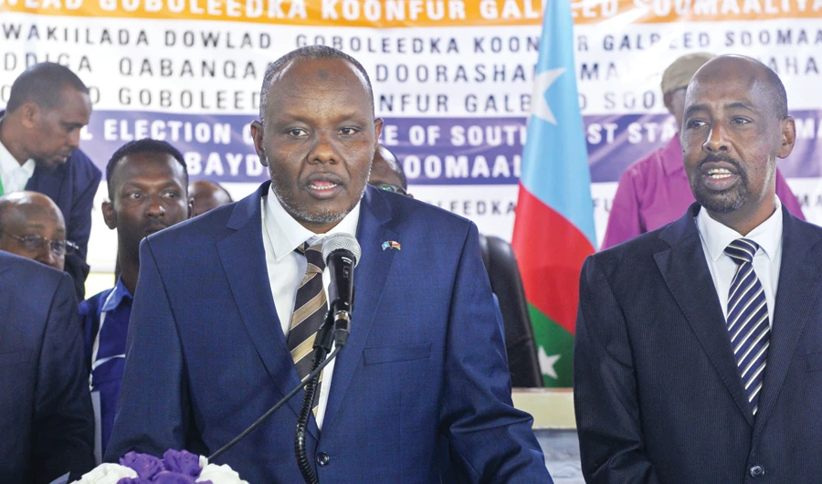 South West State President Abdiaziz Hassan Mohamed, left, after being elected among five candidates by legislators in Baidoa on Wednesday. (AFP)