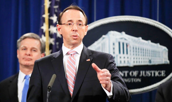 Deputy Attorney General Rod Rosenstein with FBI Director Christopher Wray, speaks during a news conference at the Department of Justice in Washington, Thursday, Dec. 20, 2018. (AP)