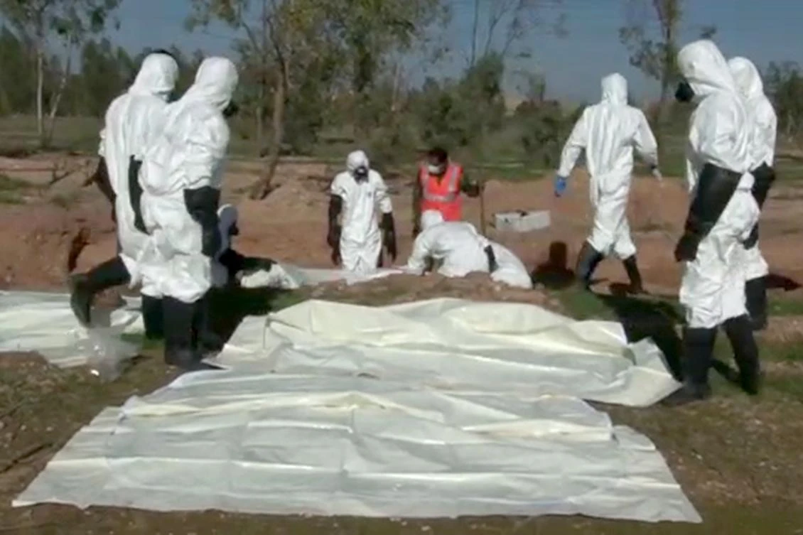 A file photo showing a mass grave in the area of Boukamal in the countryside of the Syrian province of Deir Ezzor on December 11, 2018. (AFP)