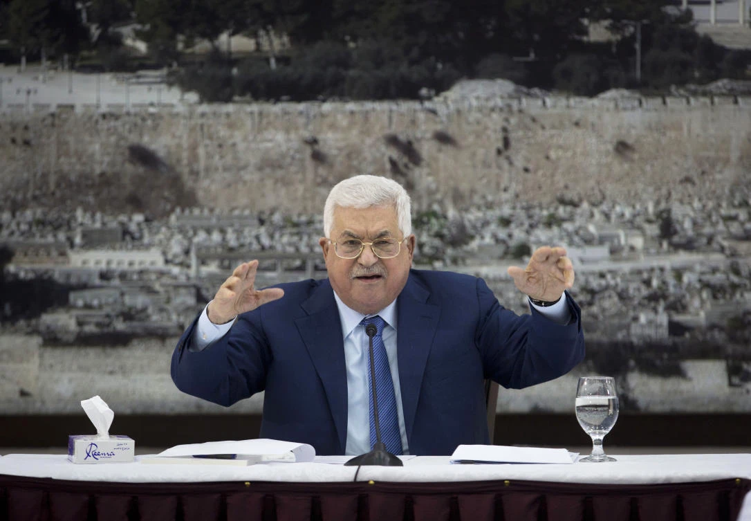 Abbas says he will implement a court order to dissolve the inactive parliament controlled by the rival Hamas movement. (AP)
