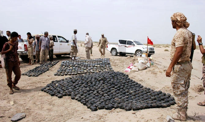 Members of a Yemeni military demining unit prepare to destroy unexploded bombs and mines collected from conflict areas near the southern port city of Aden, Yemen. (REUTERS)